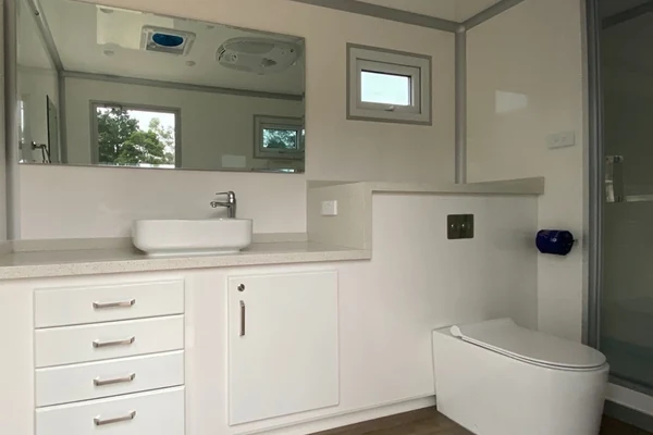 Combo restroom and shower trailer for workforce accommodation