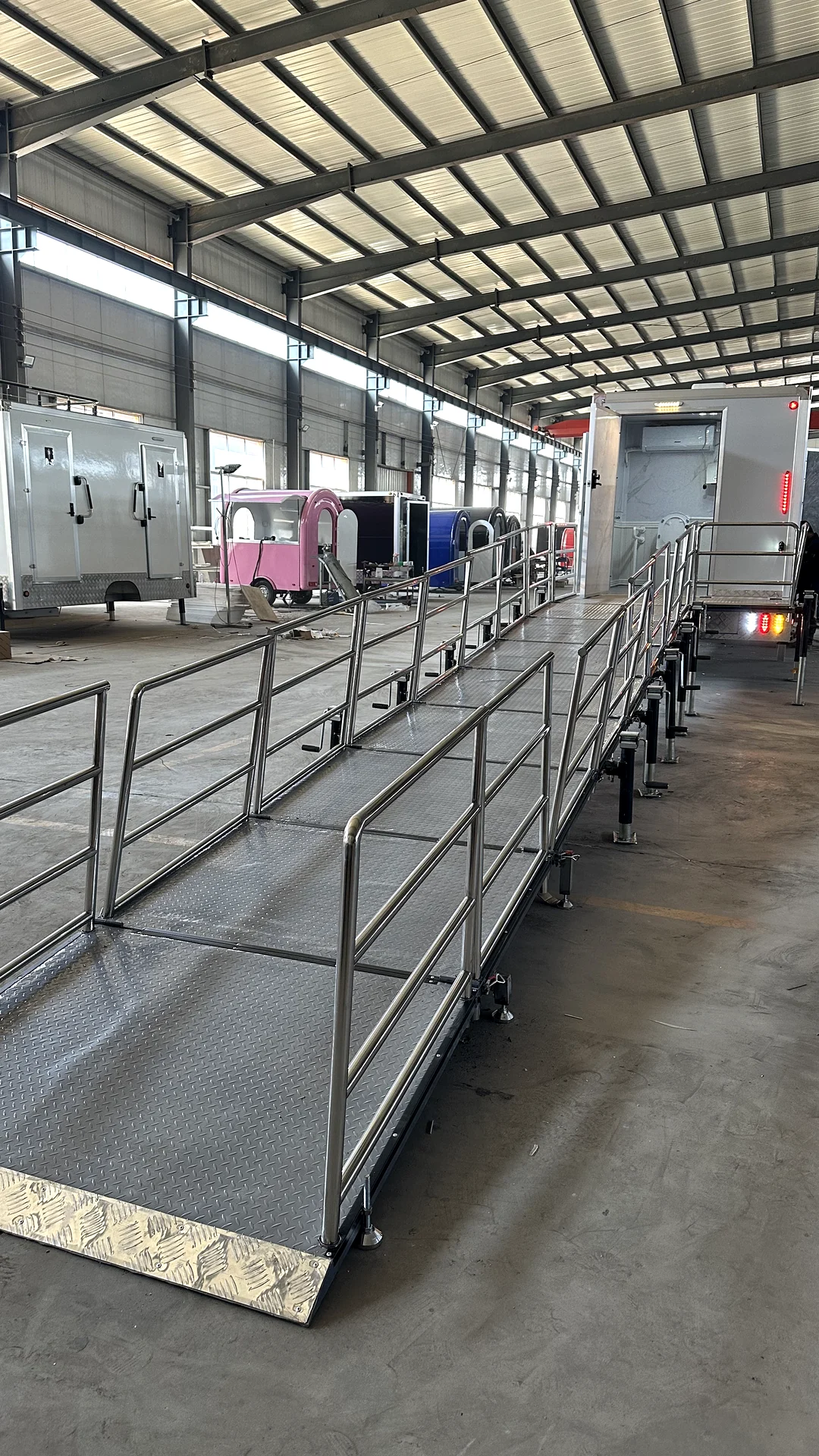 ADA restroom trailer ramp detail with handrail and accessible entry connection